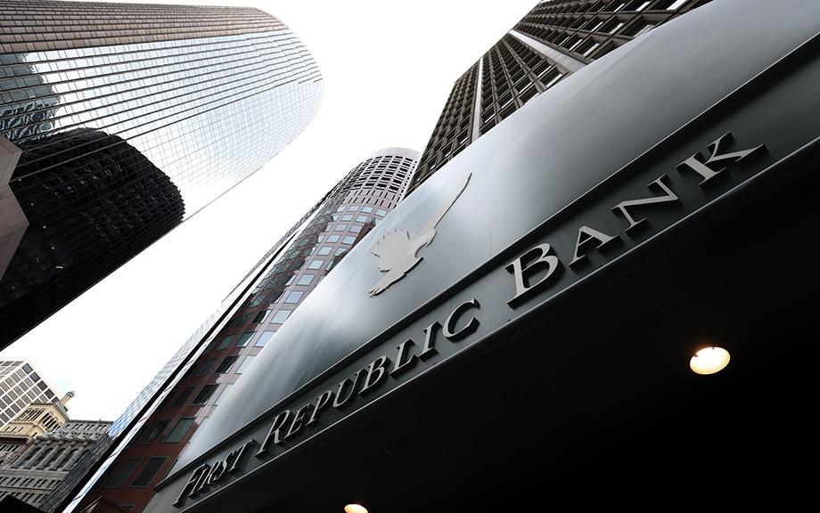 decorative image: first republic bank building photographed from the ground looking up toward the sky with a few tall buildings next to it.